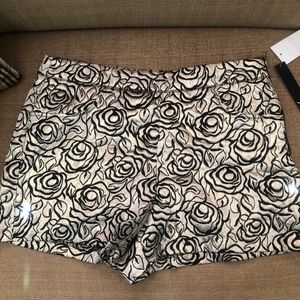 Women short XOXO gold and black NWT size 7/8